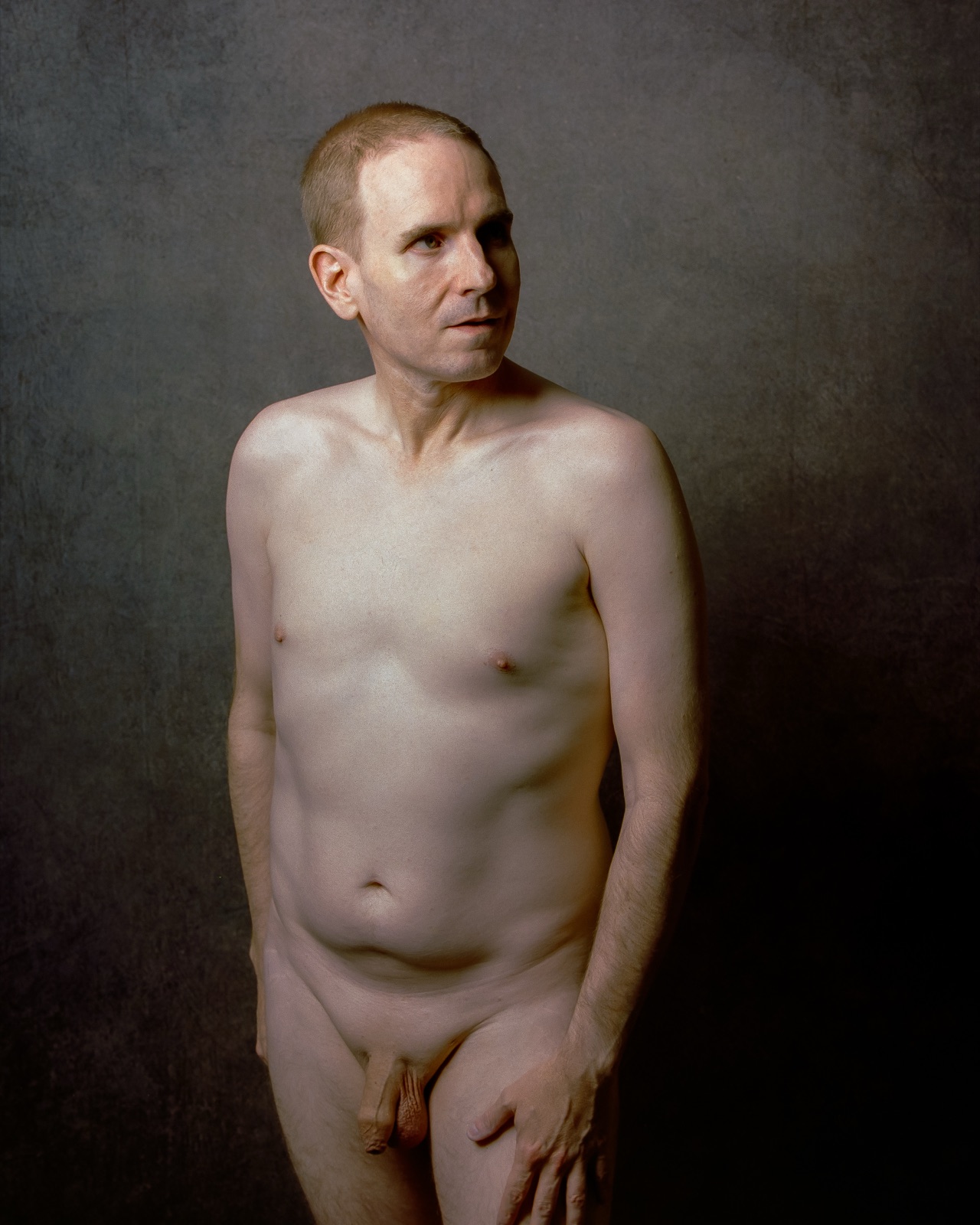 SJ Nude standing fully nude, looking away from the camera, gray backdrop, Kodak Portra 400, San Jose