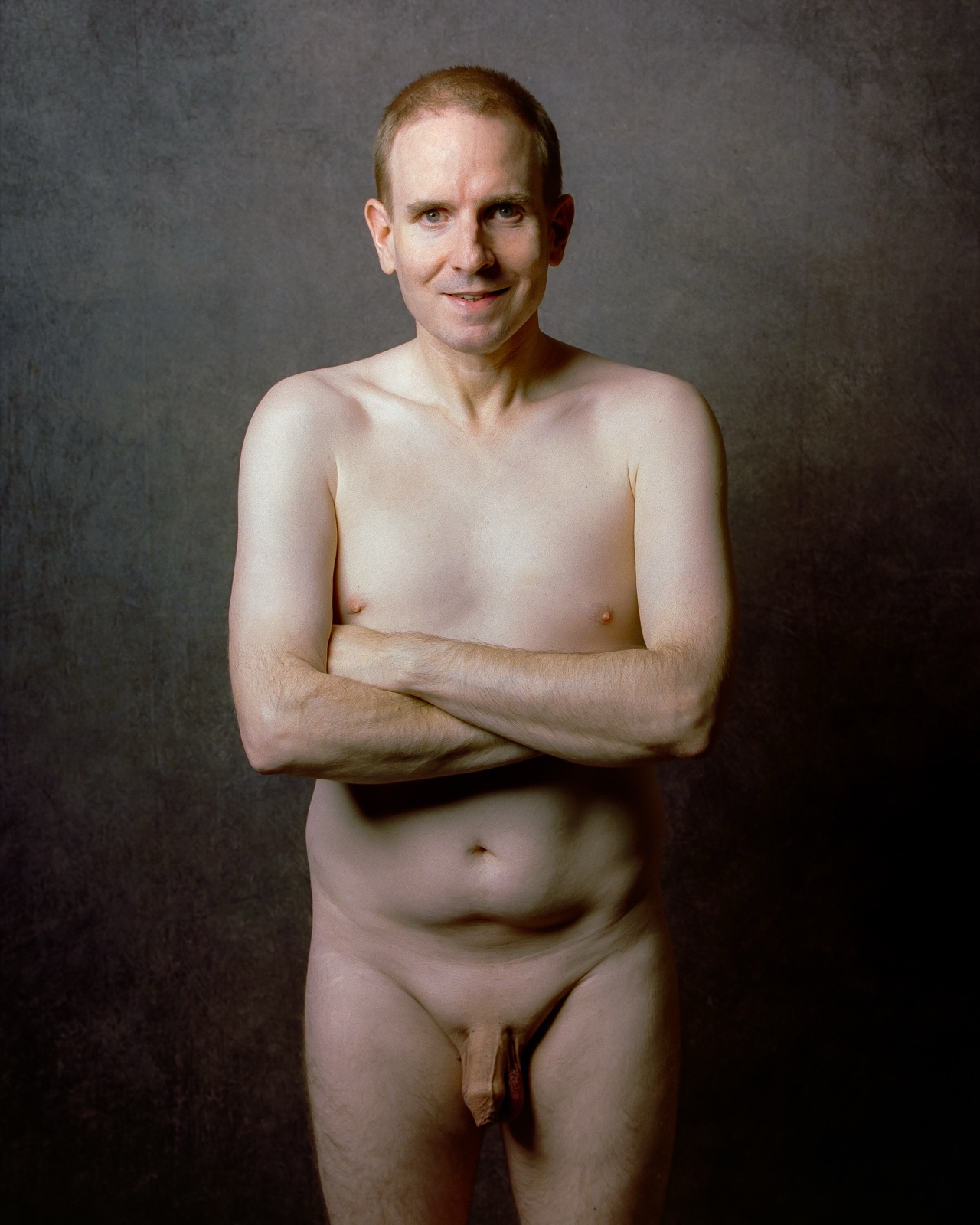 SJ Nude standing fully nude with arms crossed, gray backdrop, medium format Kodak Portra 400, San Jose